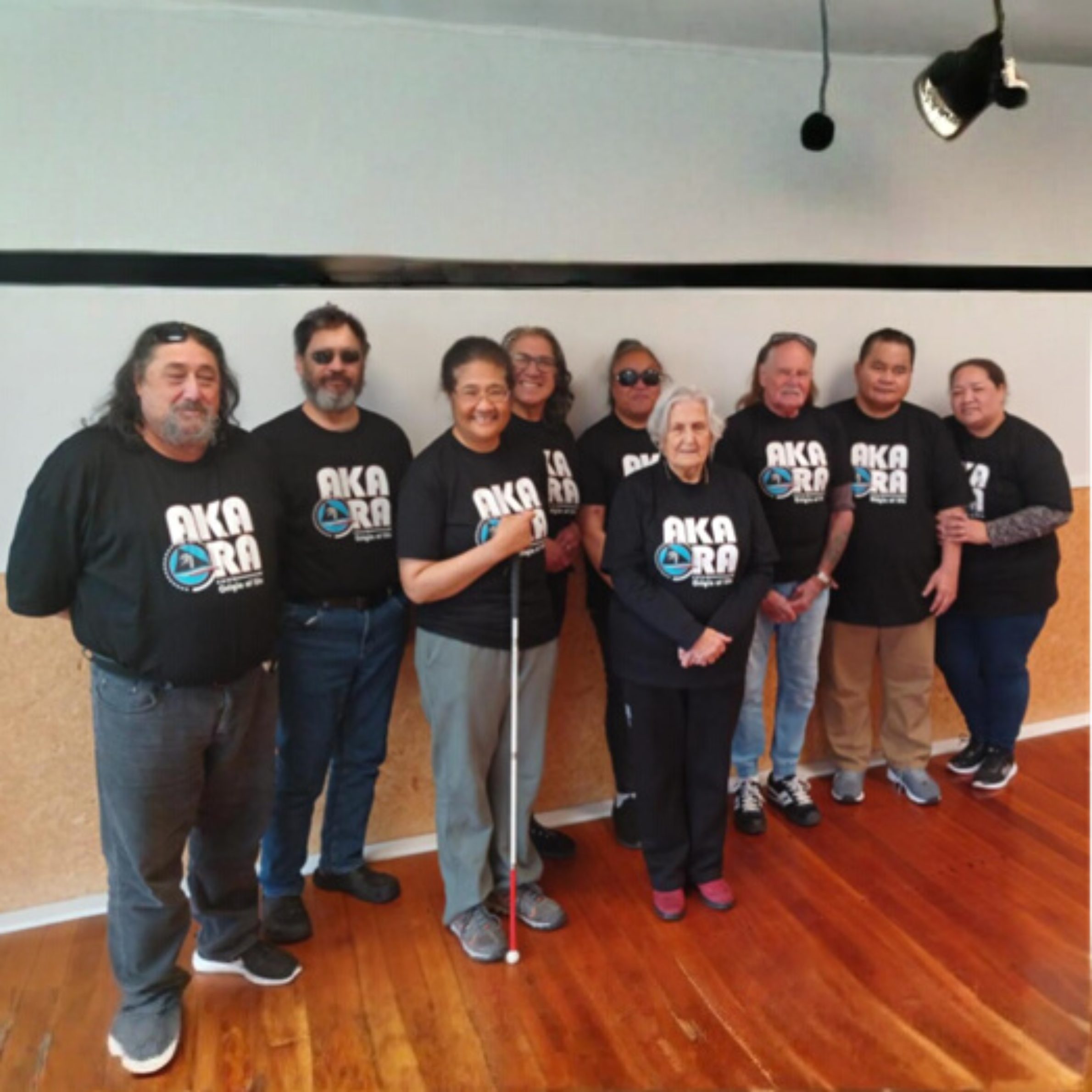 Members of the Aka Ora support group standing together.